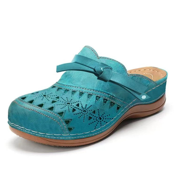 Women's Comfortable Clogs with Filigree Cutout Design and Elegant Strap Lune London