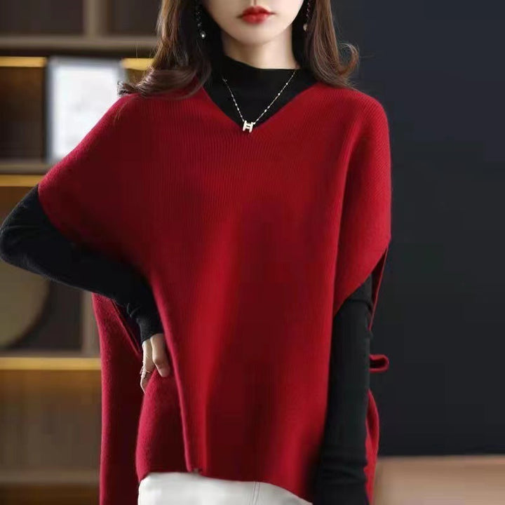 Knitted poncho for women with V-neck and chic elegant silhouette