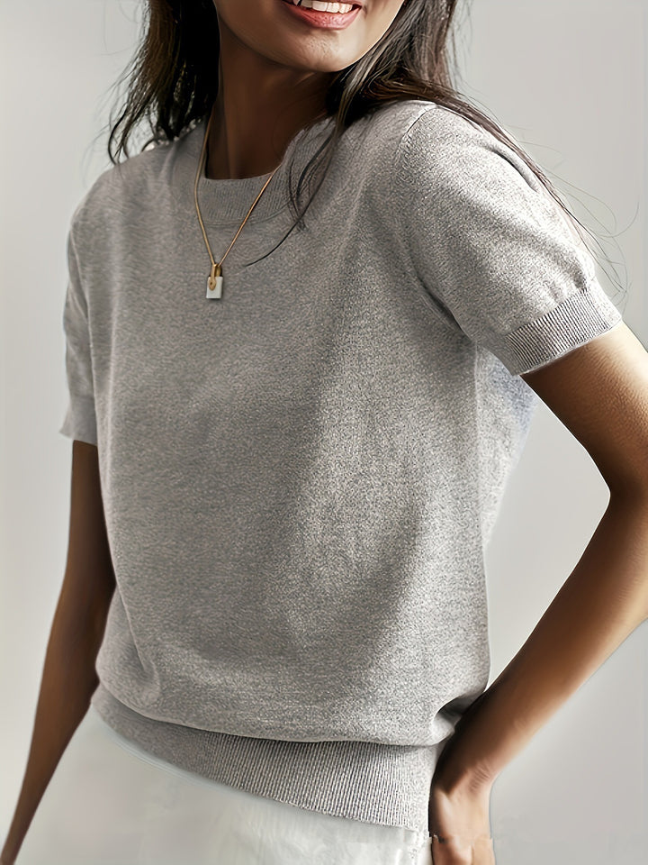 Fine knit sweater for women with a short sleeve silhouette and a soft fluid material Elegance and style