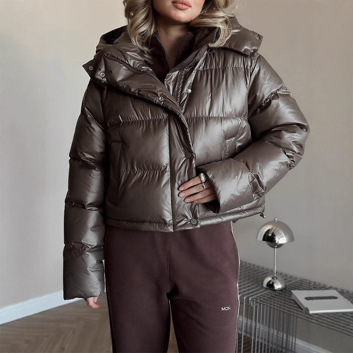 Women's short-cut shiny quilted jacket with high stand-up collar and snap-button placket Amarae