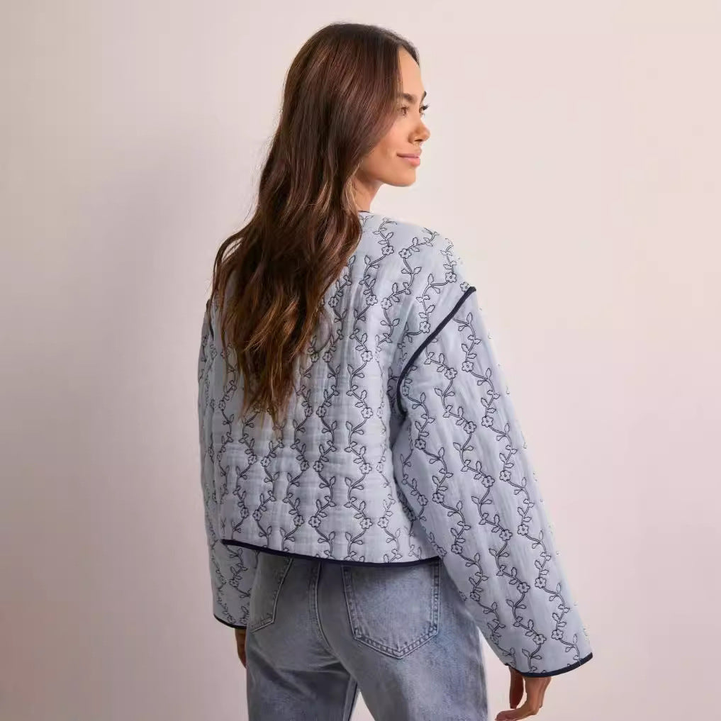 Women's lightweight quilted blouse jacket with V-neck, contrast piping and floral line print Amarae