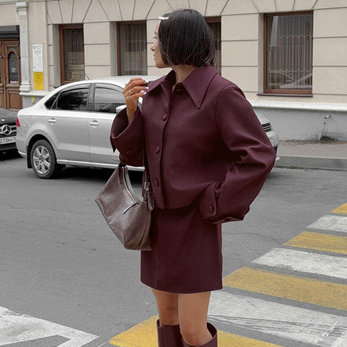 Short elegant jacket for women with a loose fit and chic stylish details