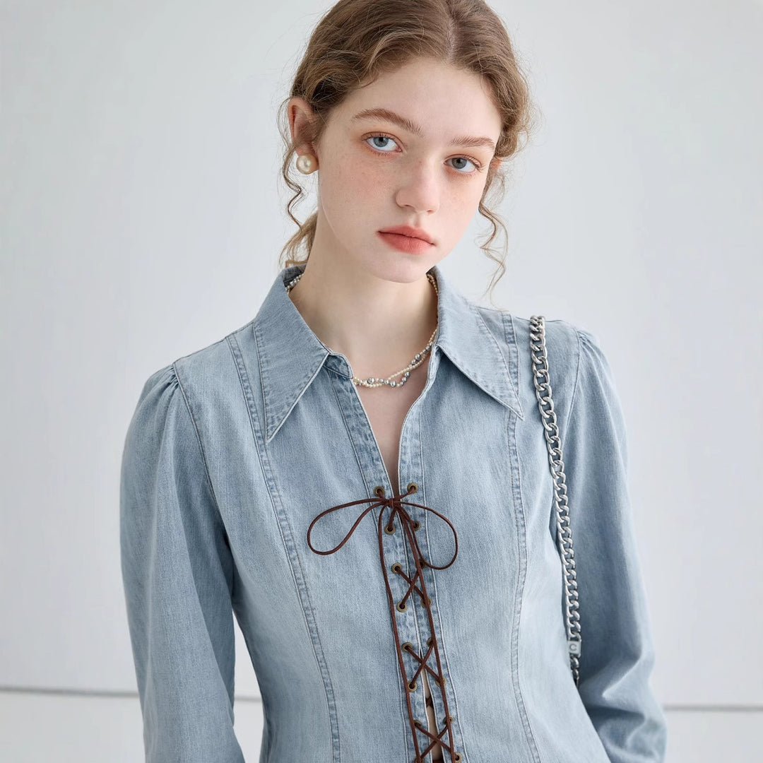 Ladies' jeans blouse with playful lacing details and elegant cut