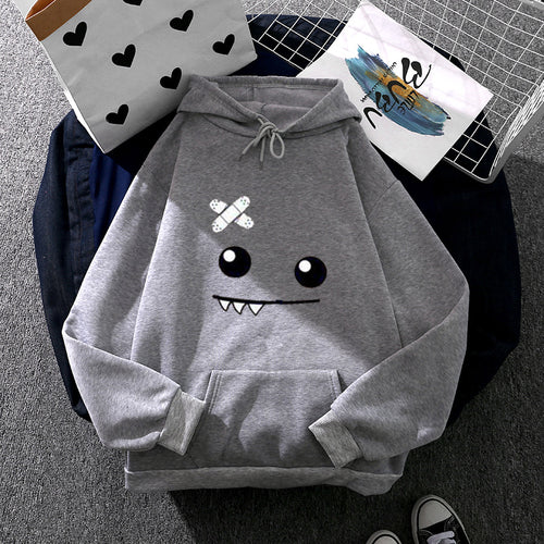 Women's hoodie with playful monster design Chic & Stil