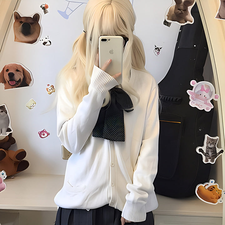 Cardigan féminin ludique avec grand col et détail de nœud Chic & Stil