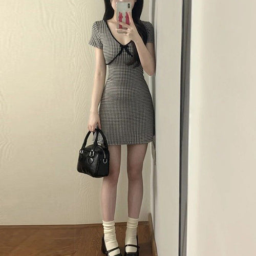 Ladies plaid mini dress with ruffle details and deep V-neck