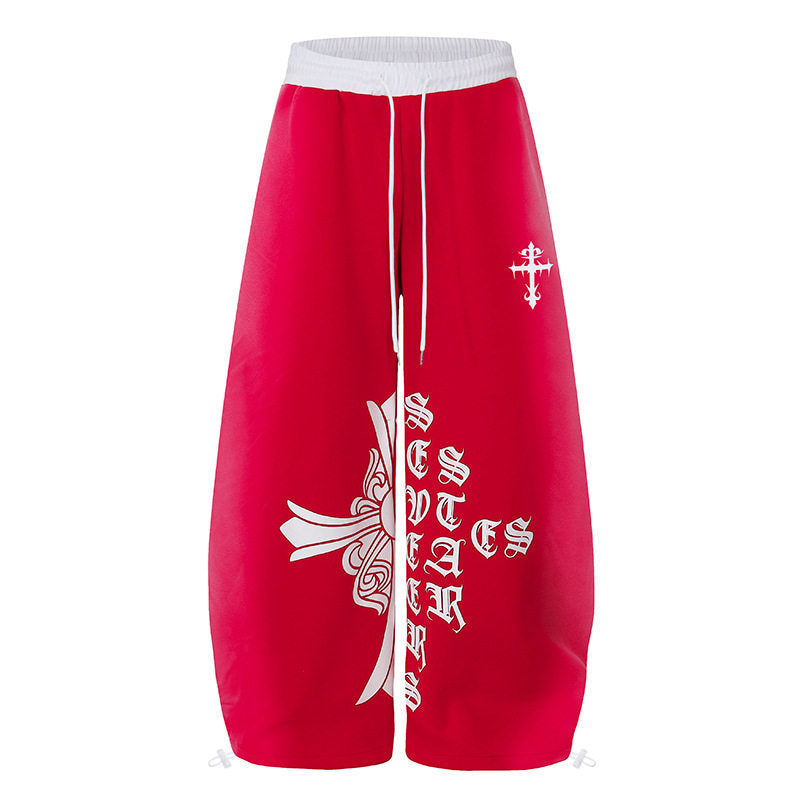 Women's extra-wide culotte sweatpants in palazzo style with a high comfort waistband, drawstring, and gothic cross print Amarae