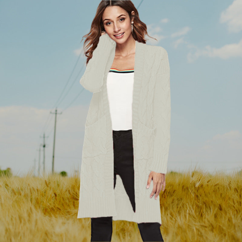 Chunky knit cardigan for women with an elegant cable design and practical pockets Lune London
