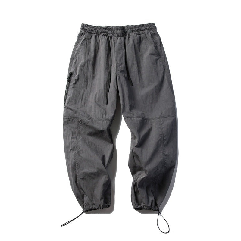Unisex Technical Cargo Pants in Baggy Cut with Drawstring Waist and Adjustable Leg Closures Amarae