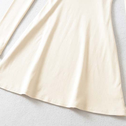 Ladies form-fitting mini dress with a deep V-neckline, gathered bust, and crossed back straps Amarae
