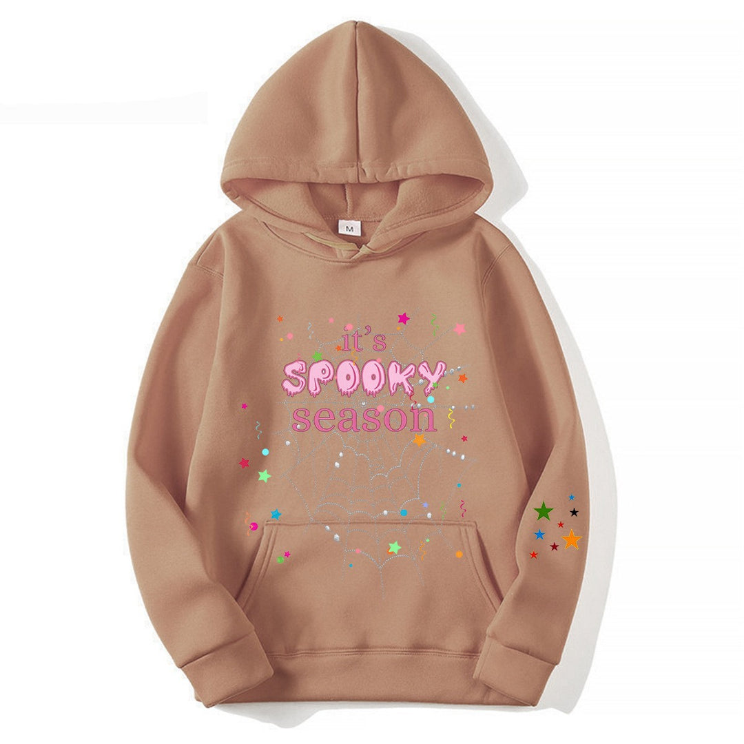 Women cozy hoodie with graphic Halloween design Chic & Stil