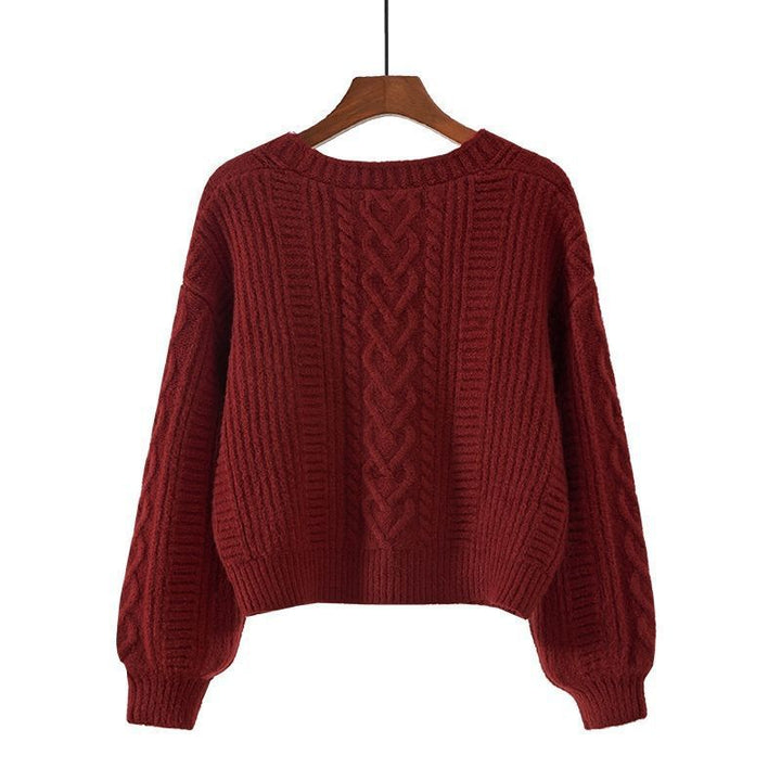 Ladies cozy knitted pullover with cable pattern and button closure Lune London