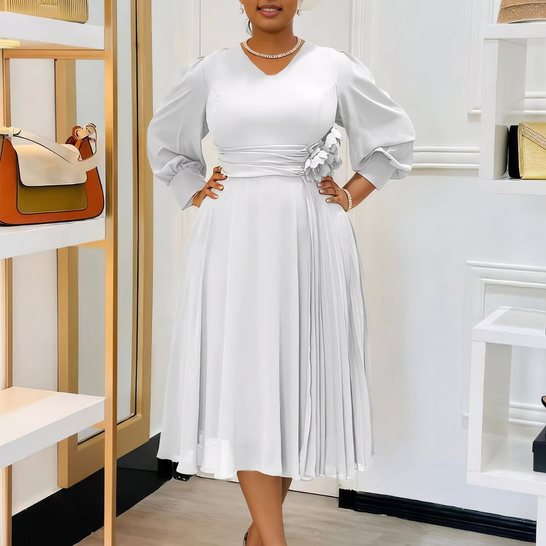 Elegant dress for women with decorative floral accent and draping Lune London