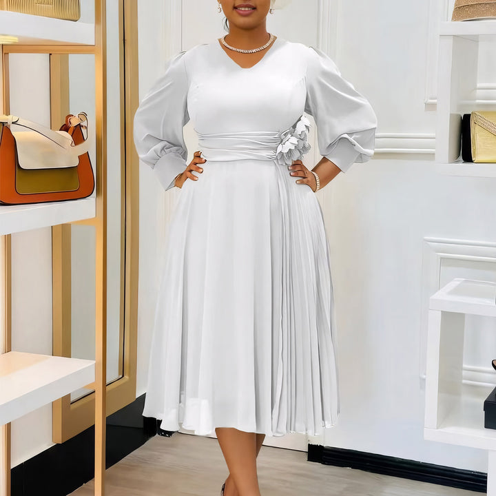 Elegant dress for women with decorative floral accent and draping Lune London