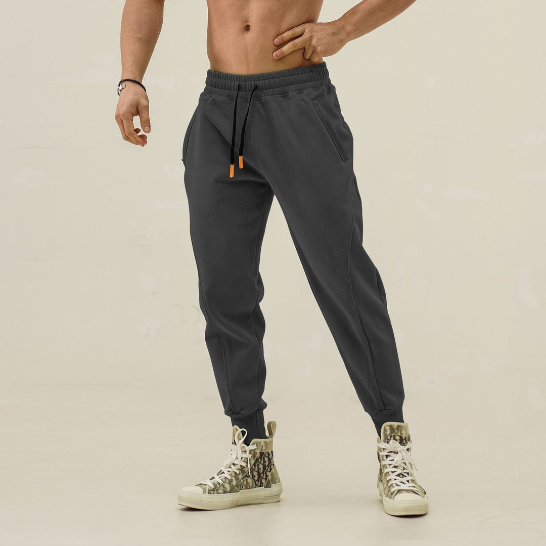 Sporty jogger pants for men with elastic waistband and stylish contrasting stripes Lune London