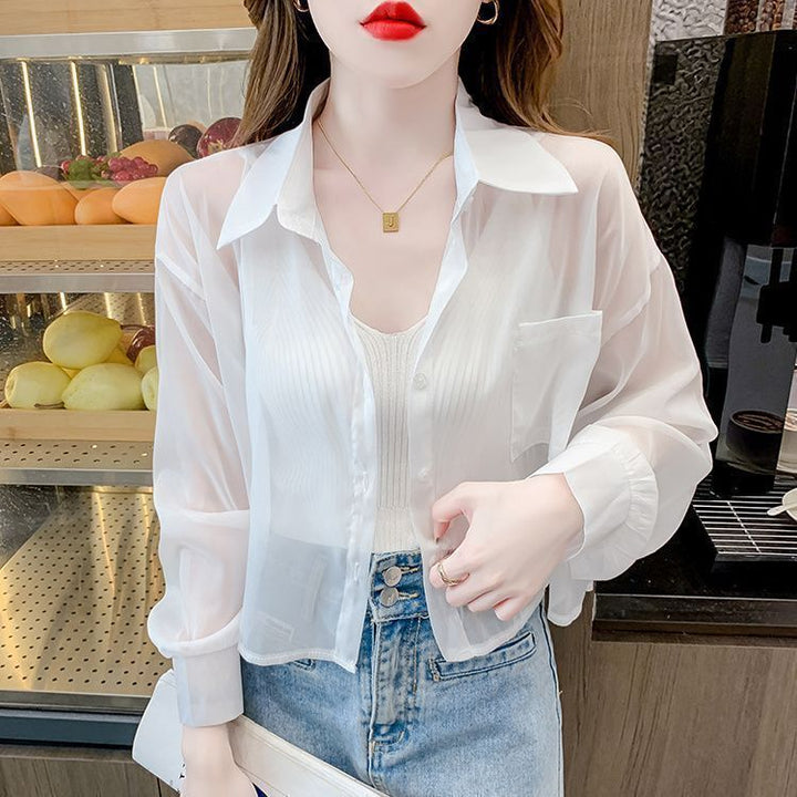 Blouse transparente pour femmes avec un délicat col en V et de fins détails en rib Chic & Stil