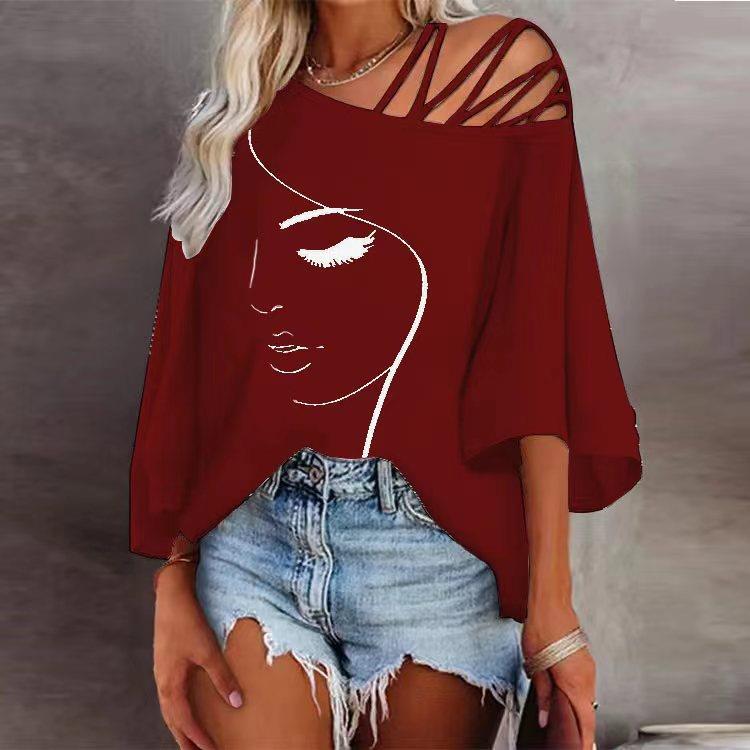 Women's tunic with asymmetric strap design and stylized face graphic Lune London