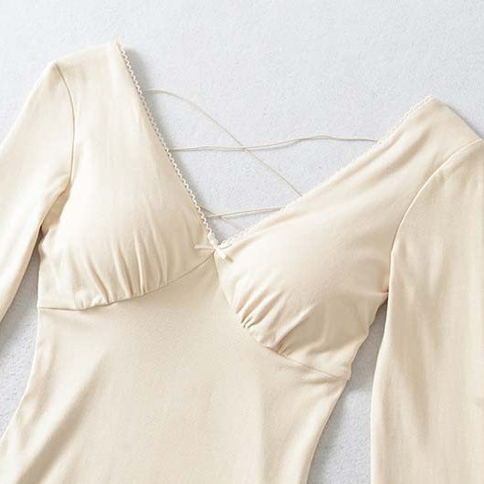 Ladies form-fitting mini dress with a deep V-neckline, gathered bust, and crossed back straps Amarae