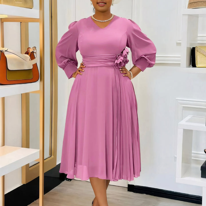 Elegant dress for women with decorative floral accent and draping Lune London