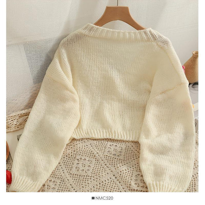 Ladies cozy knit cardigan with playful floral appliqués Lune London