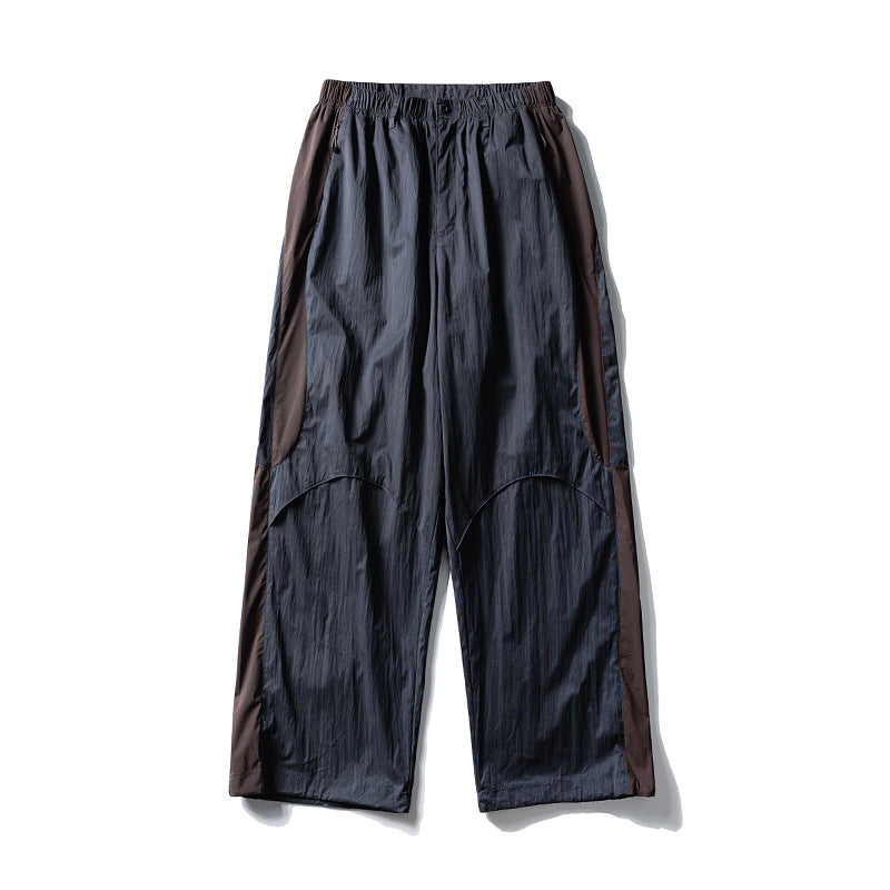 Men's loose technical nylon cargo pants with elastic waistband and panel details Amarae