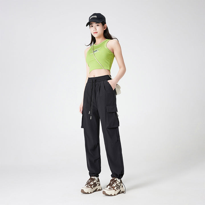 Women’s cargo pants in outdoor style with drawstring waistband, large side pockets, and adjustable hem.