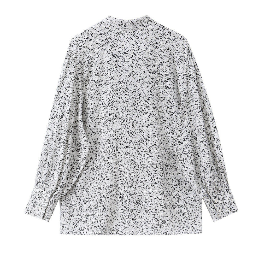 Ladies blouse with peplum and fine polka dot pattern, balloon sleeves and cuffs
