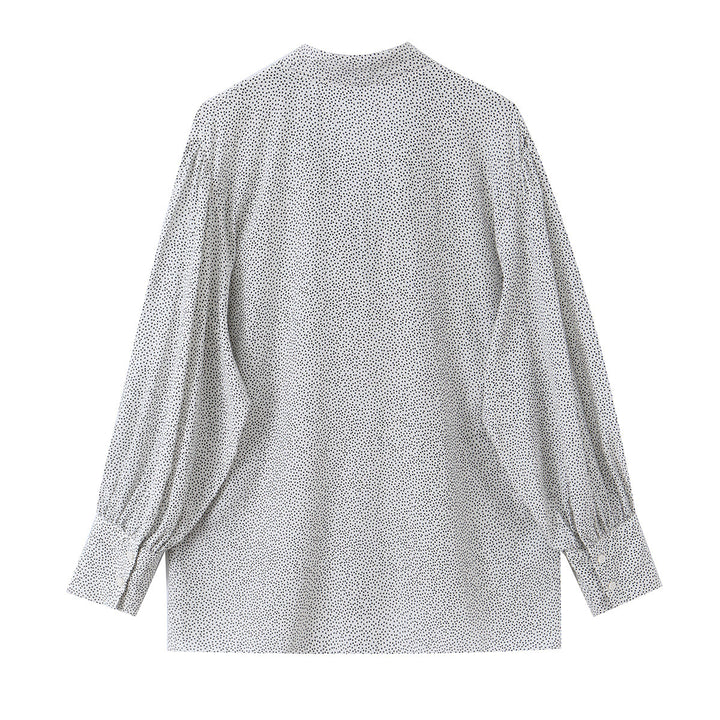 Ladies blouse with peplum and fine polka dot pattern, balloon sleeves and cuffs