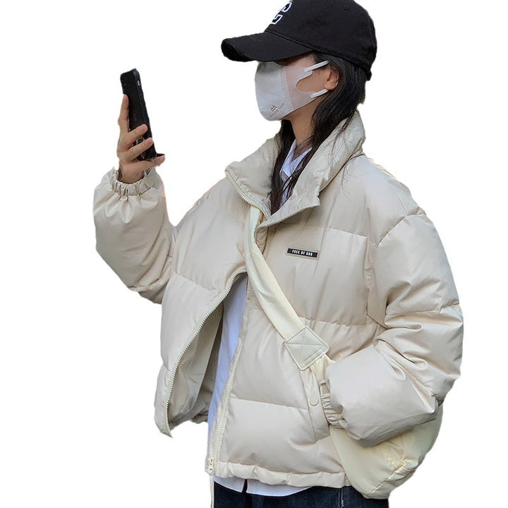 Trendy winter jacket for women with a high collar and zippered side pockets.