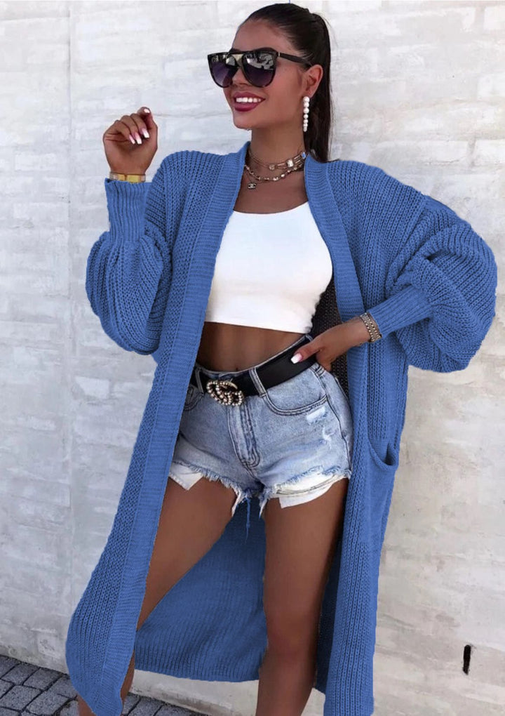 Long knitted coat for women with oversized sleeves and practical pockets Lune London