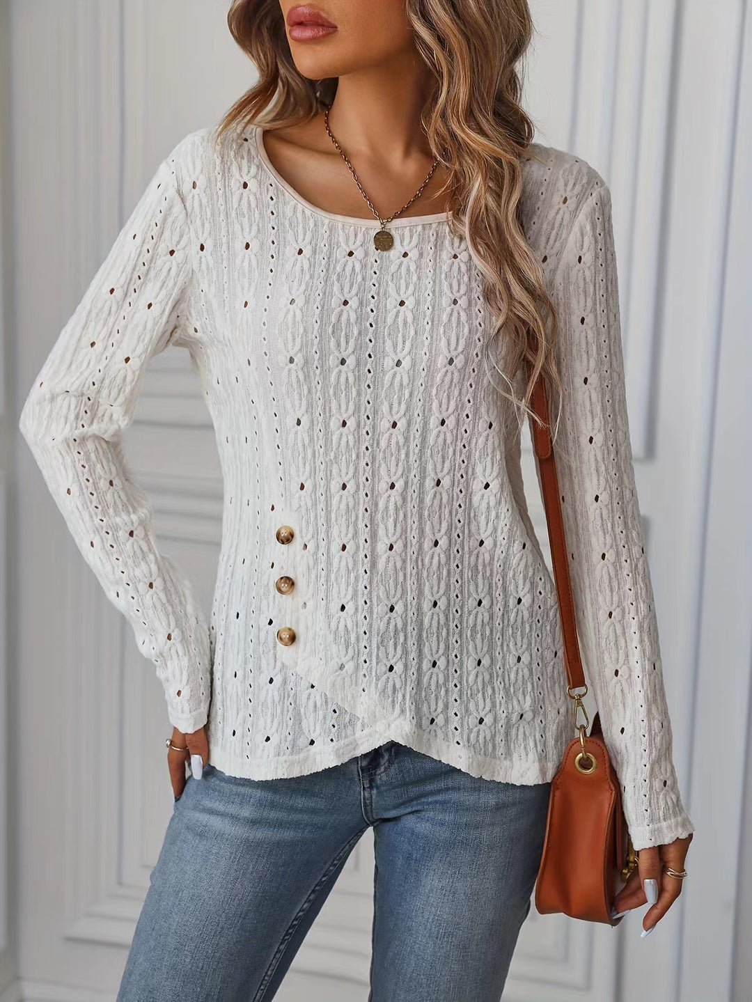 Long sleeve blouse for women with an intricate crochet pattern and chic button details