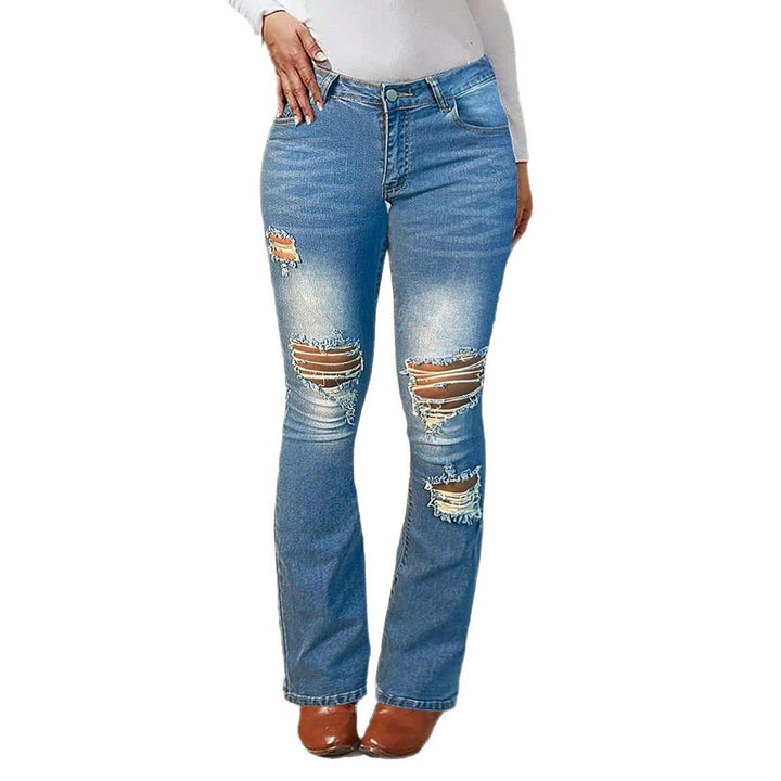 Women's waist-accentuated stretch denim jeans with flared leg and prominent knee rips Amarae