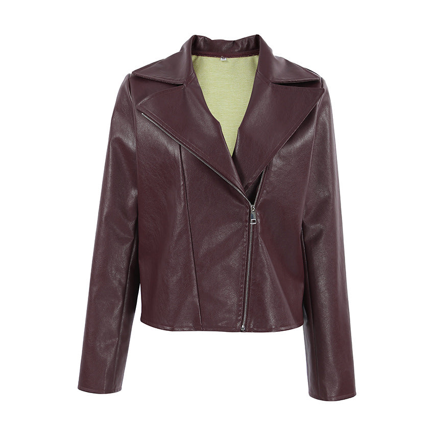 Synthetic leather biker jacket for women with a slim fit and chic metal zippers.