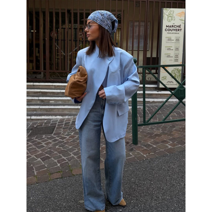 Women’s oversized long blazer with boxy silhouette, soft shoulders, and extended cut.