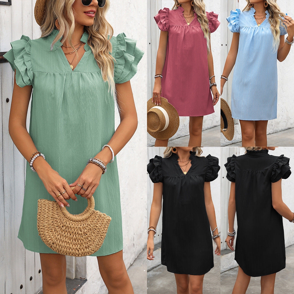 Elegant short-sleeve dress for ladies with ruffle details and V-neck Lune London