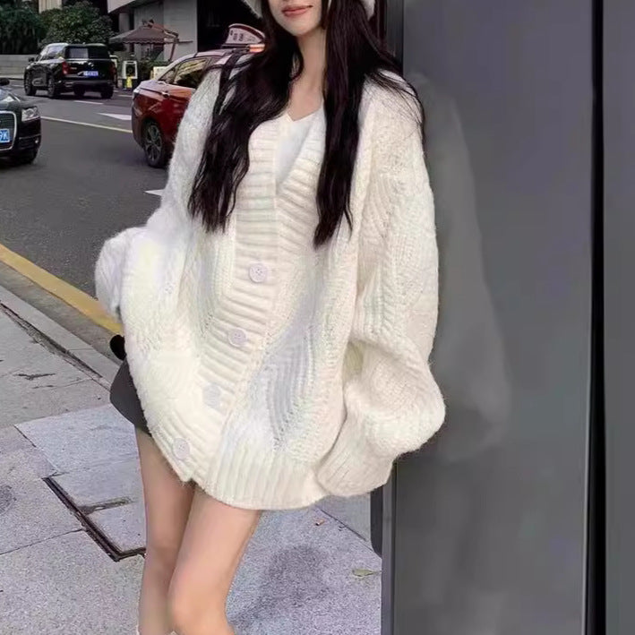 Ladies oversized knit cardigan with oversized sleeves and large button details Lune London