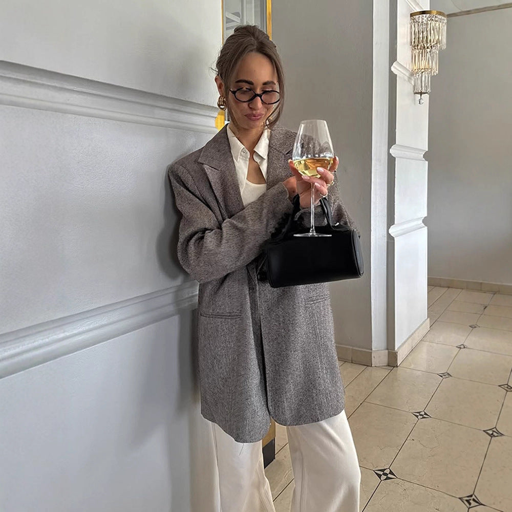 Women's long oversized wool blend coat with single-breasted button placket, notched lapels, and side pockets Amarae