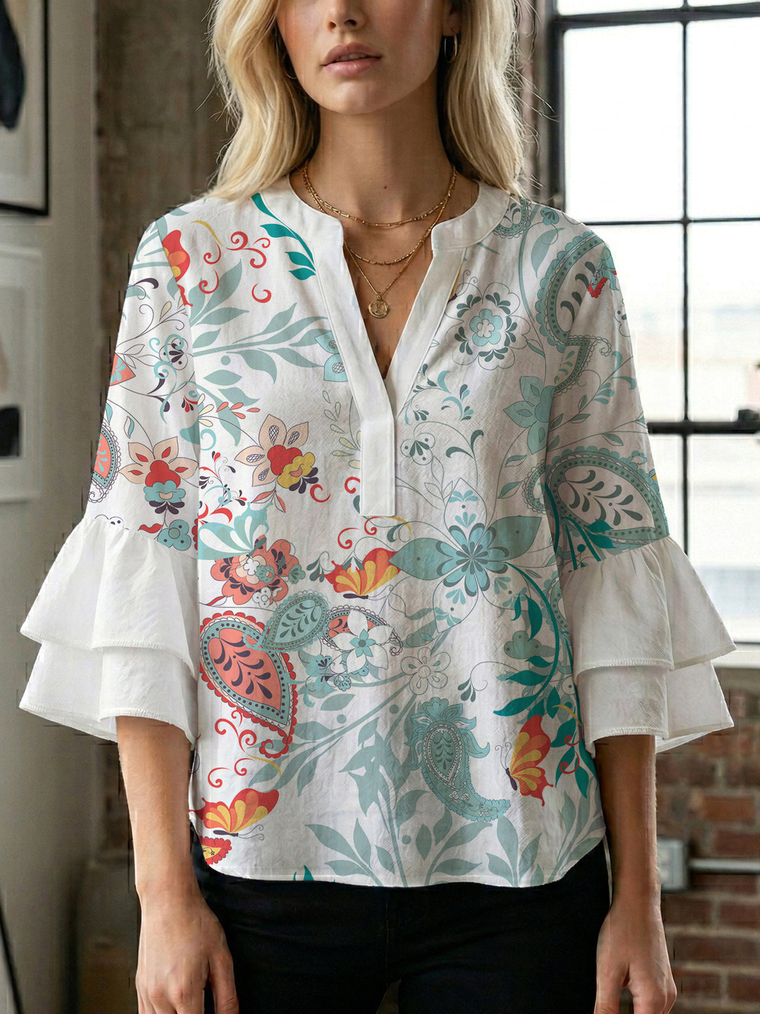 Ladies elegant top with voluminous ruffle hems and floral design Lune London