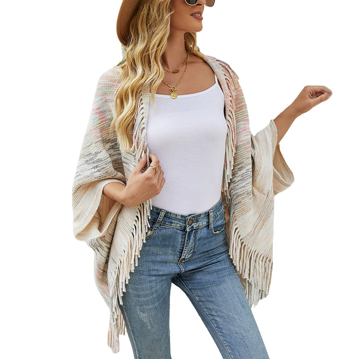Trendy women's poncho with fringed hem and structured design Lune London