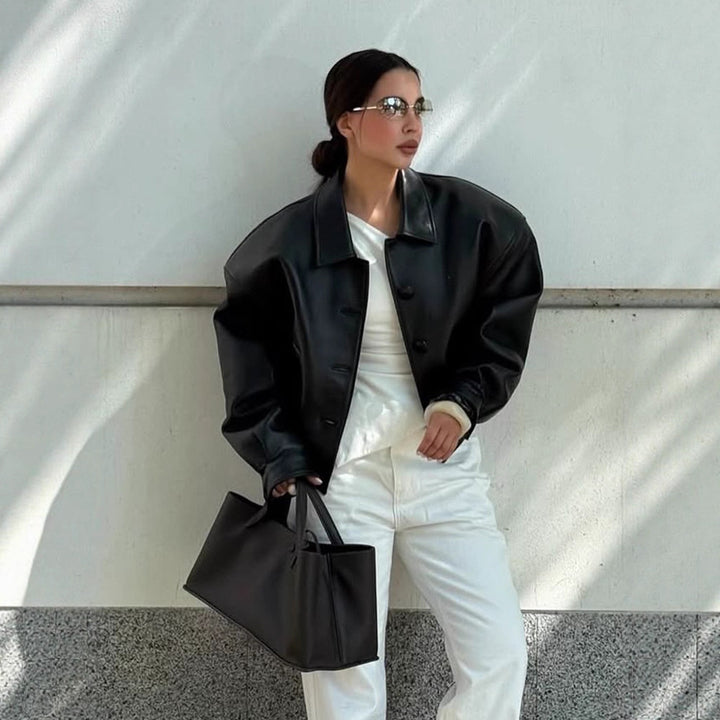 Women's short jacket made of vegan leather imitation in boxy cut with oversized shoulders and hidden button placket Amarae