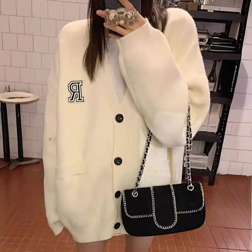 Casual knitted jacket for women with front pockets and button closure Amarae