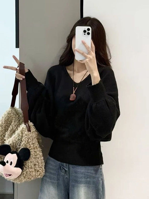 Pull féminin ample avec ceinture ajustable et décolleté en V Chic & Stil