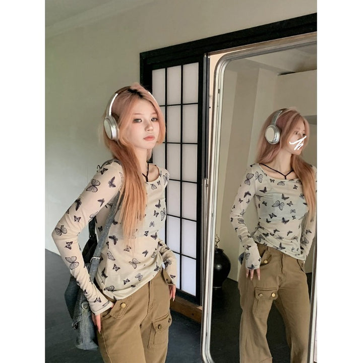 Women's long sleeve top with delicate butterfly pattern Chic & Stil