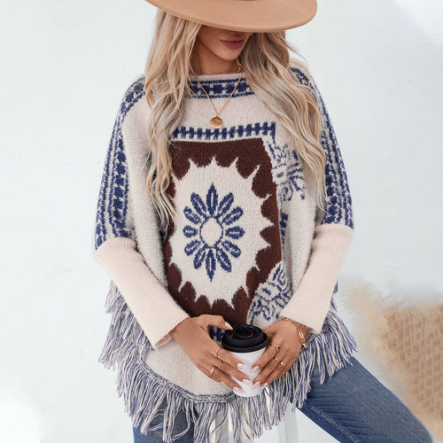 Ladies elegant knitted poncho with artistic pattern and fringe finish Amarae