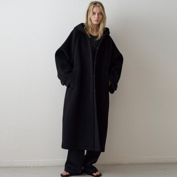 Manteau surdimensionné élégant pour femmes avec capuche et poches pratiques Chic & Stil