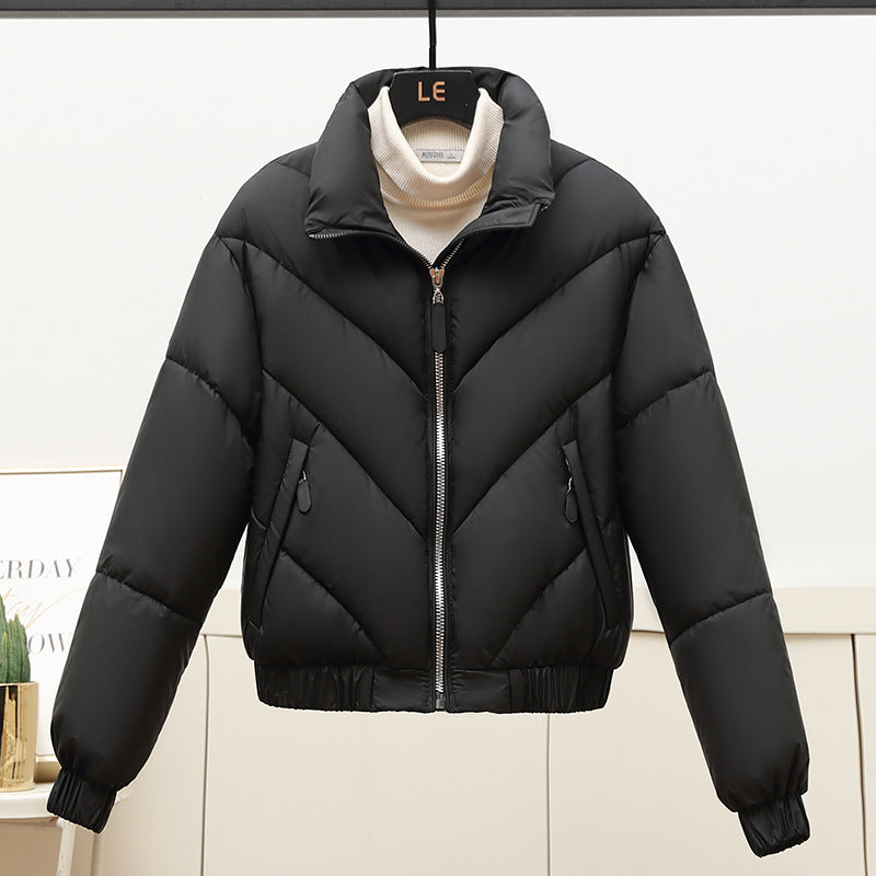 Trendy and comfortable women's puffer jacket with high collar and practical piped pockets Lune London