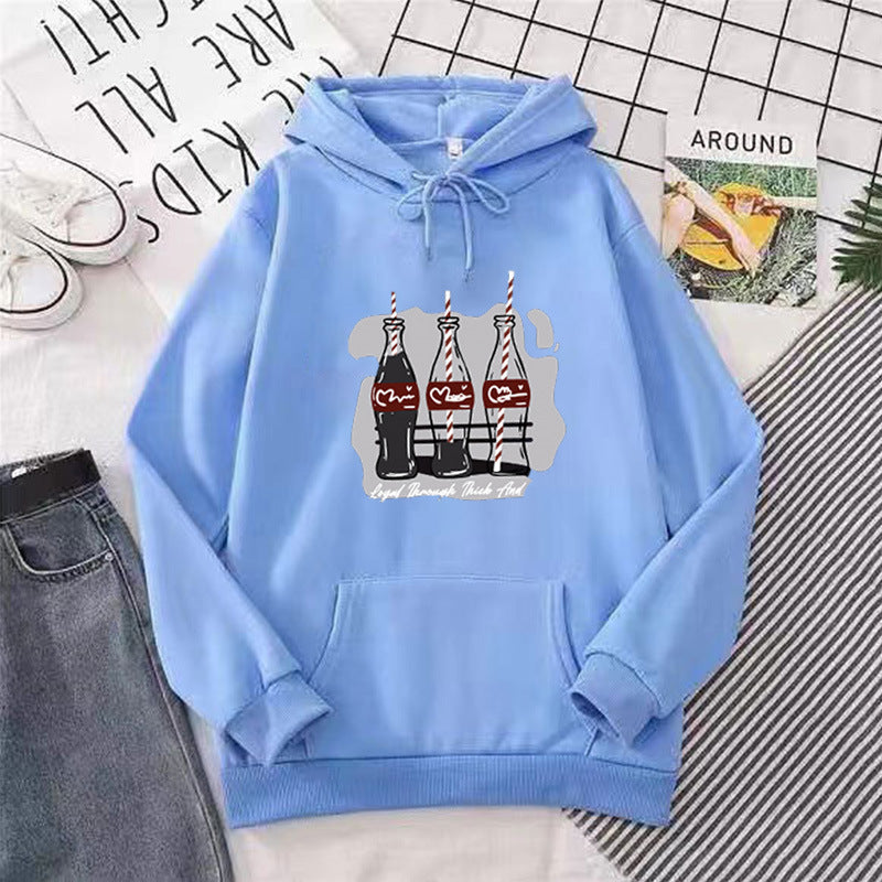 Women's hooded sweatshirt with playful Coca-Cola bottle motif Chic & Stil