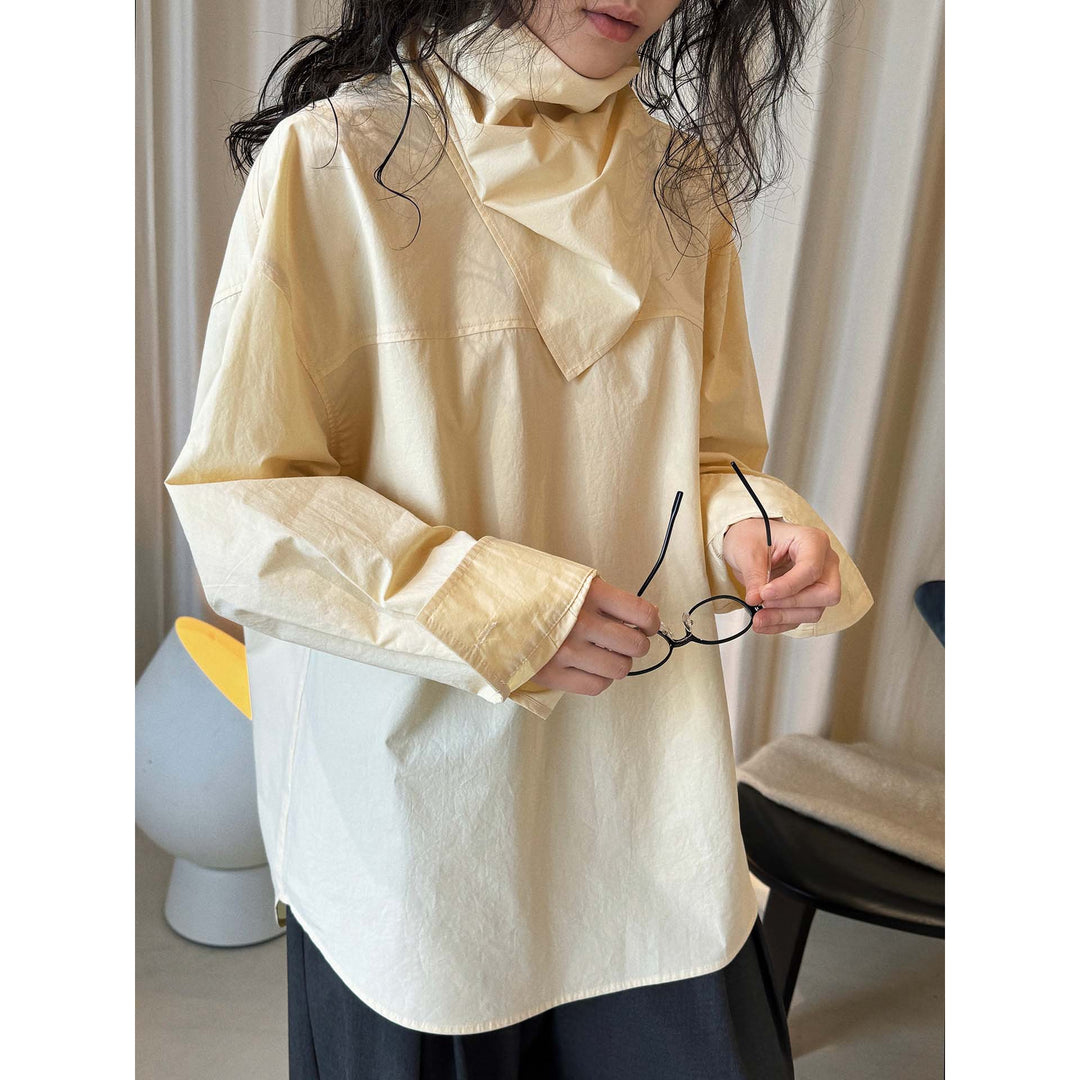 Women loosely cut cotton blouse with wrapped shawl collar and wide cuffs
