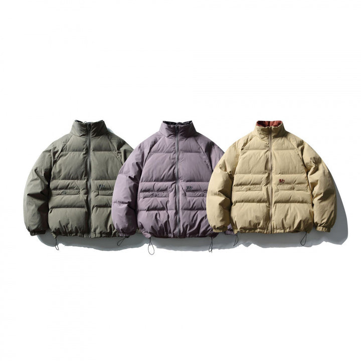 Unisex Boxy padded stand collar puffer jacket with drawstring hem and flap pockets Amarae