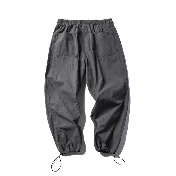 Unisex Technical Cargo Pants in Baggy Cut with Drawstring Waist and Adjustable Leg Closures Amarae